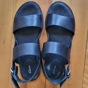 Flat black leather strap sandals